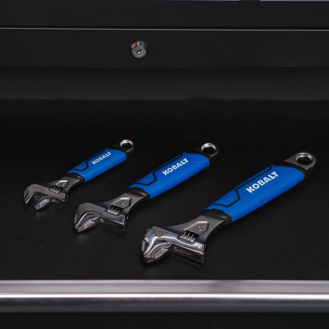 Three black and blue Kobalt adjustable wrenches.